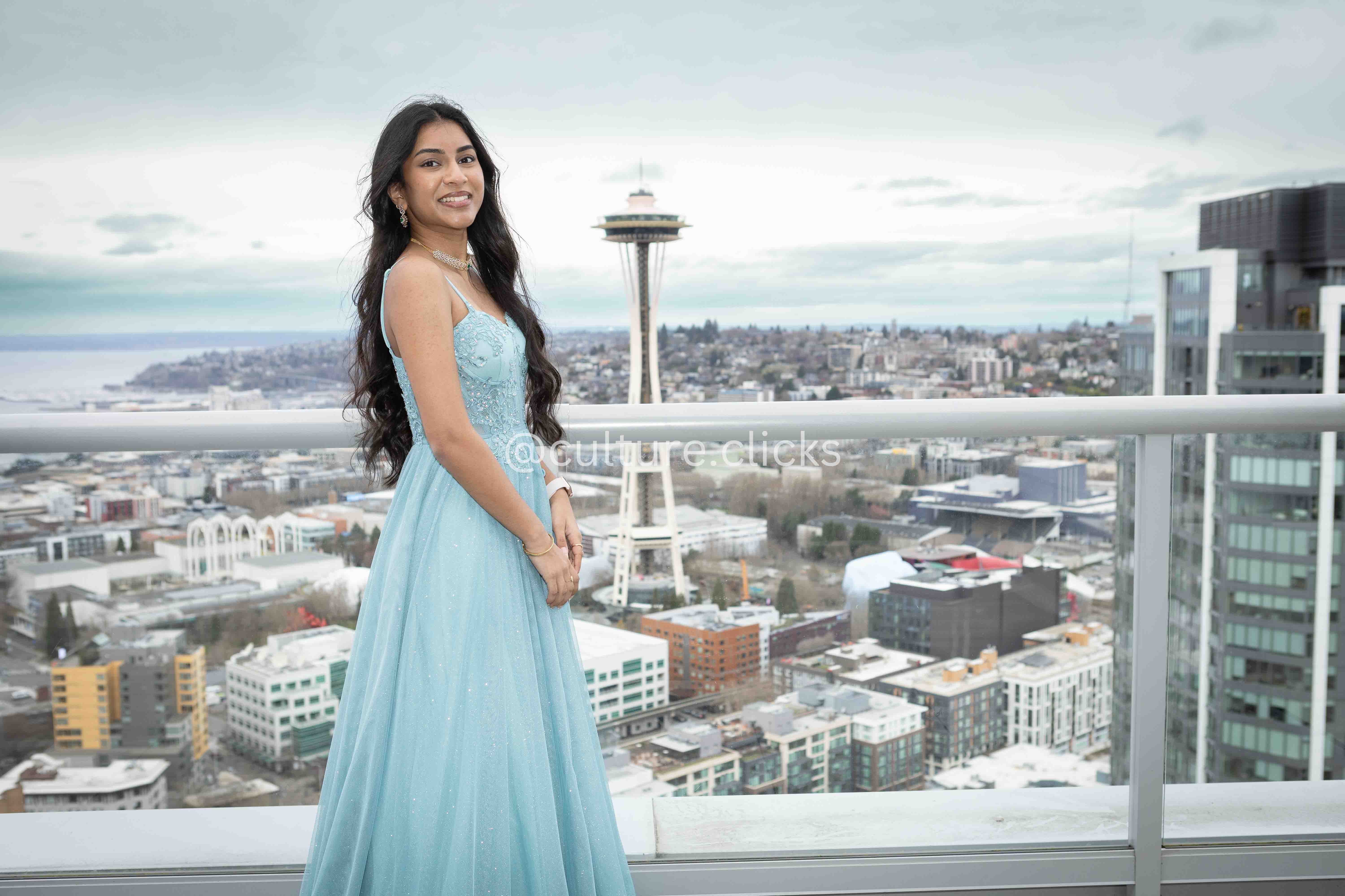 Breathtaking view of seattle space needle background. sweet 16 Birthday photography in front of space needle in seattle done by cultureclicks photography