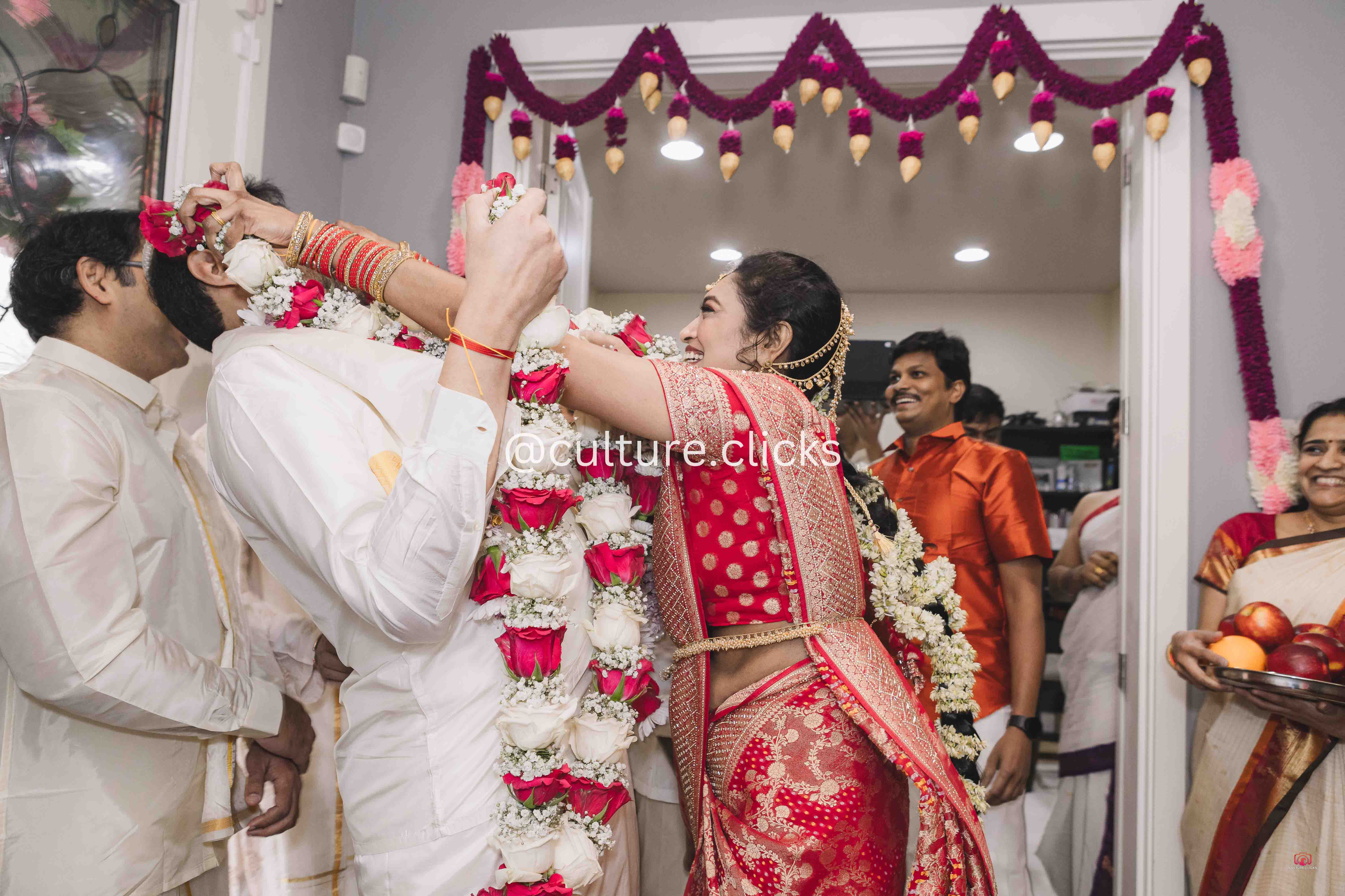 tamil traditional style wedding. Groom is dodging away from beautiful wife bride, photography captured by culture clicks photography by seattle indian wedding photographer
